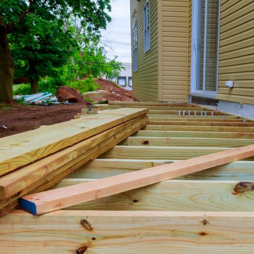 A installation wooden deck or patio new home, timber deck being constructed