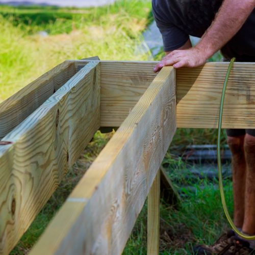 A new wooden, timber deck being constructed. it icompleted. can be seen on the decking.