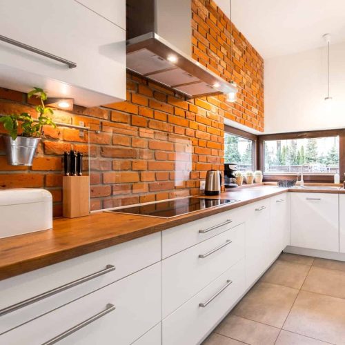 Brick wall in modern kitchen